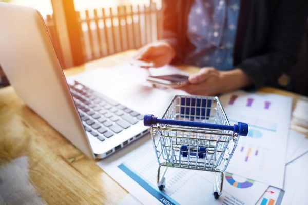 cropped-image-woman-inputting-card-information-key-phone-laptop-while-shopping-online cropped-image-woman-inputting-card-information-key-phone-laptop-while-shopping-online